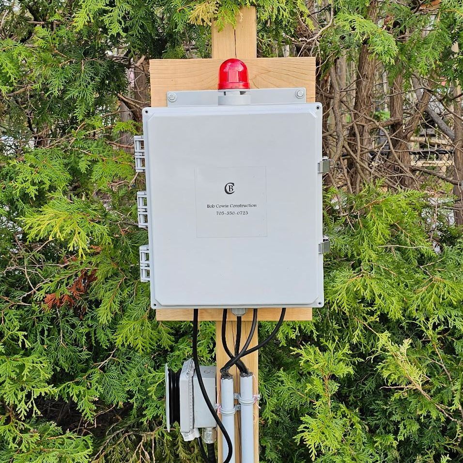 Septic Installation Alarm Response  - A white box with a red light on top of it
