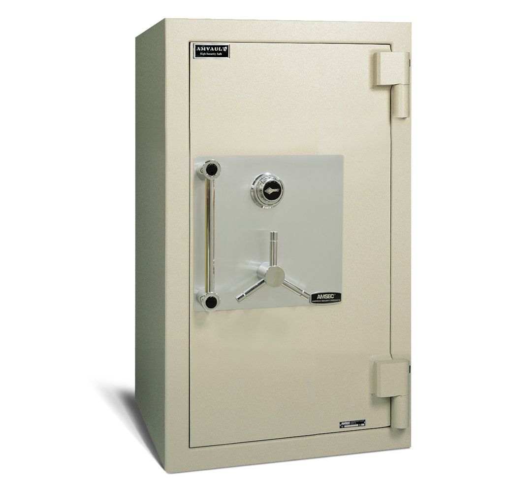 A white safe with a key on the door