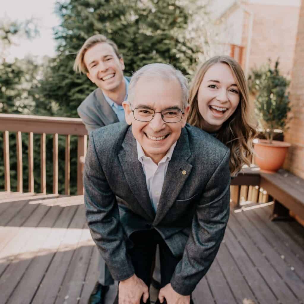 Photo of Christopher and his kids: from Back to Front: son Colin, daughter Sloan, and father Chris.