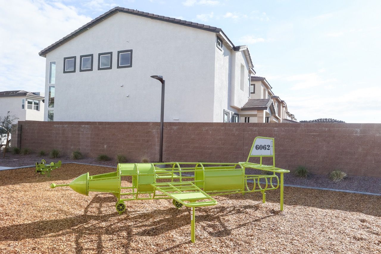 a patio with a couch and chairs and a table