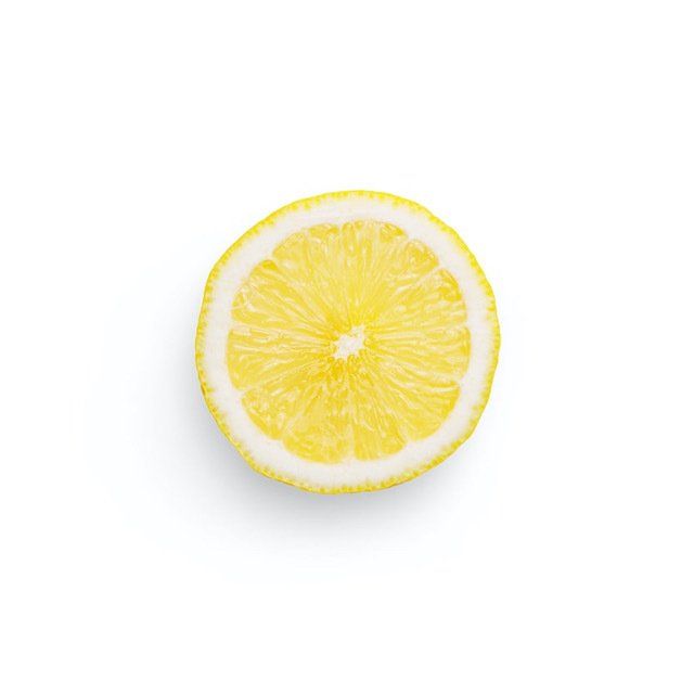 A slice of lemon represents citric acid which is one of the ingredients in Carolina Turf's organic weed control.