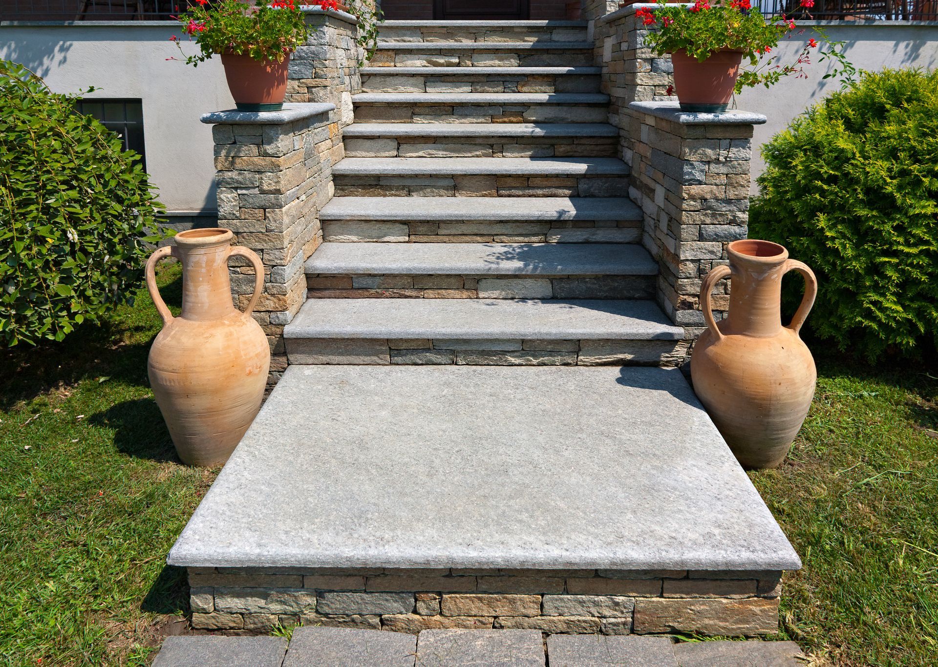 A set of stone stairs leading up to a house