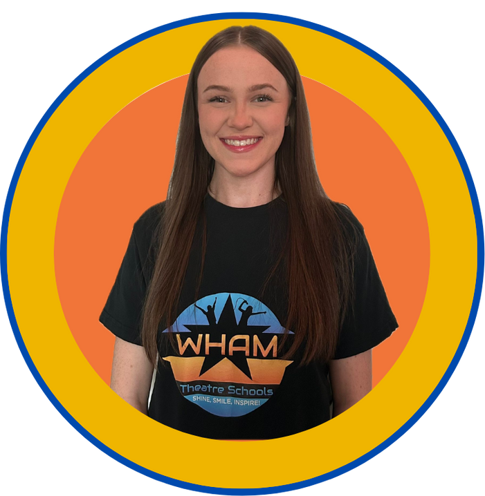 A woman wearing a black shirt with the word wham on it