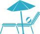 A person is laying on a beach chair under an umbrella.