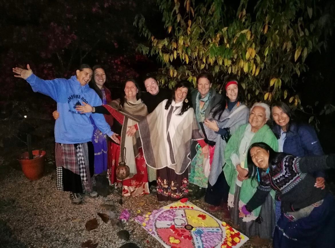 A group of people are posing for a picture in the dark