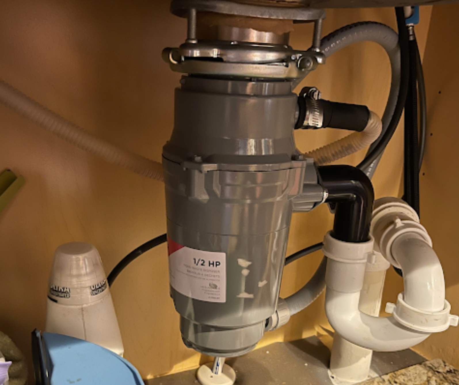 A garbage disposal with a 1/2 hp label on it