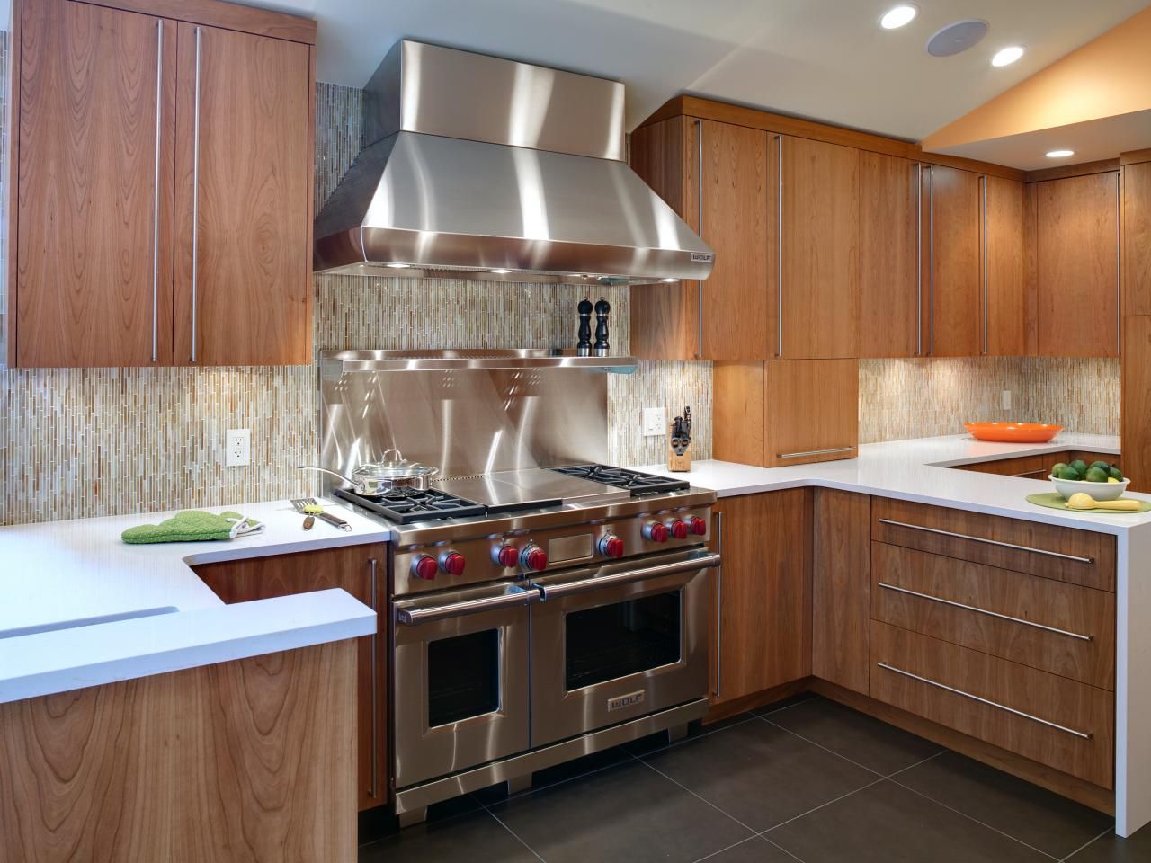 A kitchen with stainless steel appliances and wooden cabinets