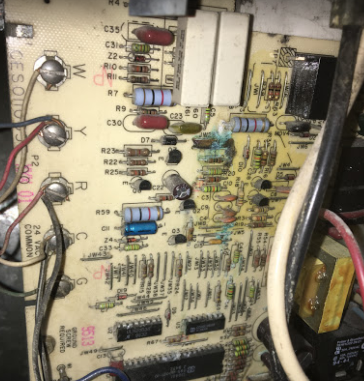 A close up of a circuit board with the letters c and r on it