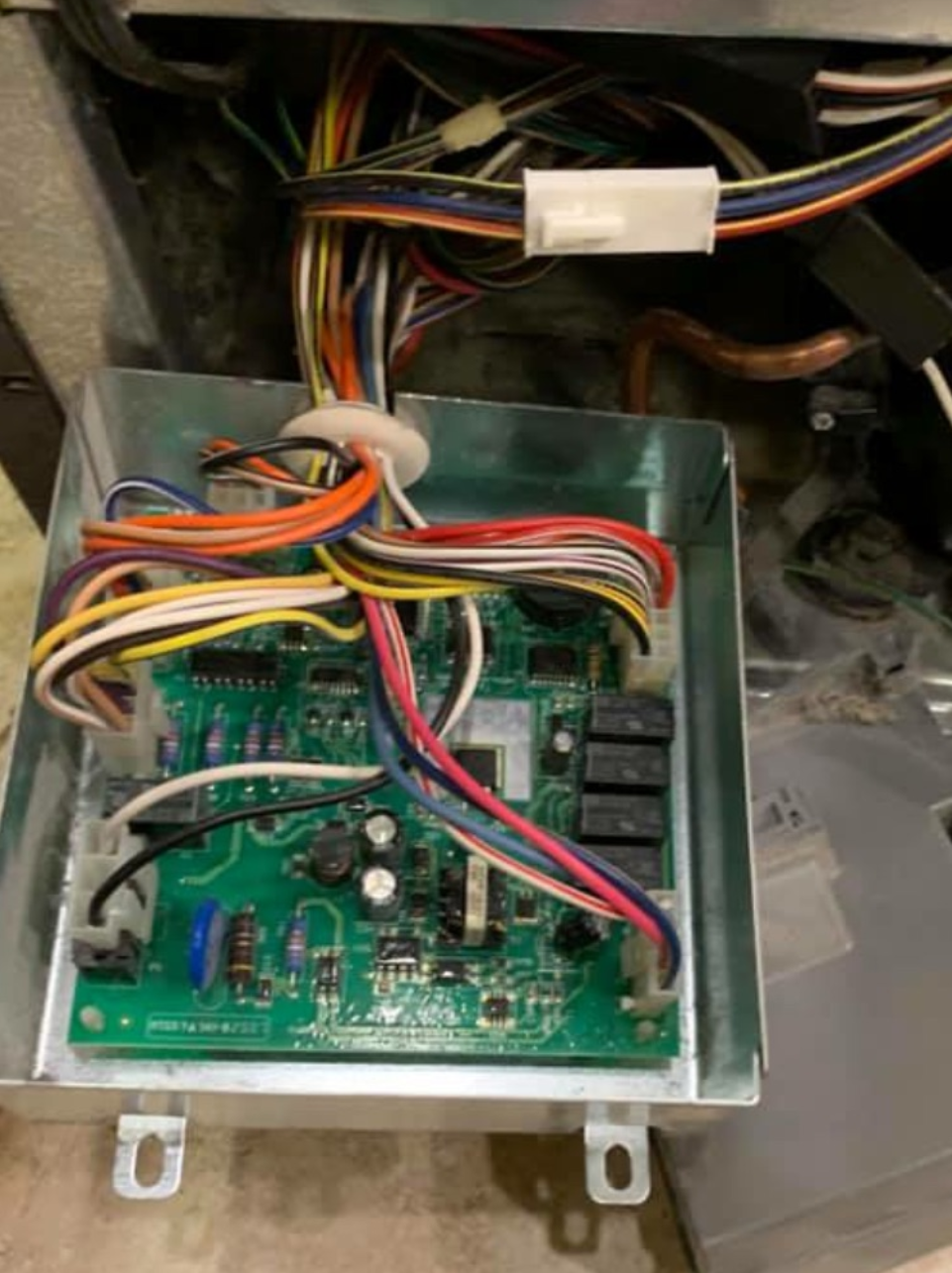 A box with a lot of wires coming out of it.