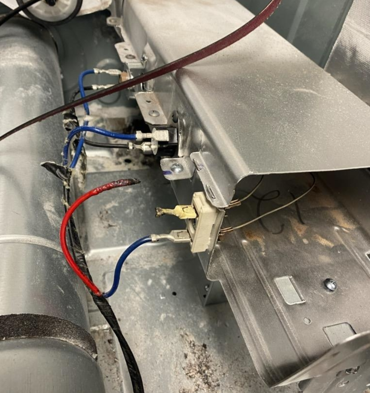 A bunch of wires are connected to a metal item