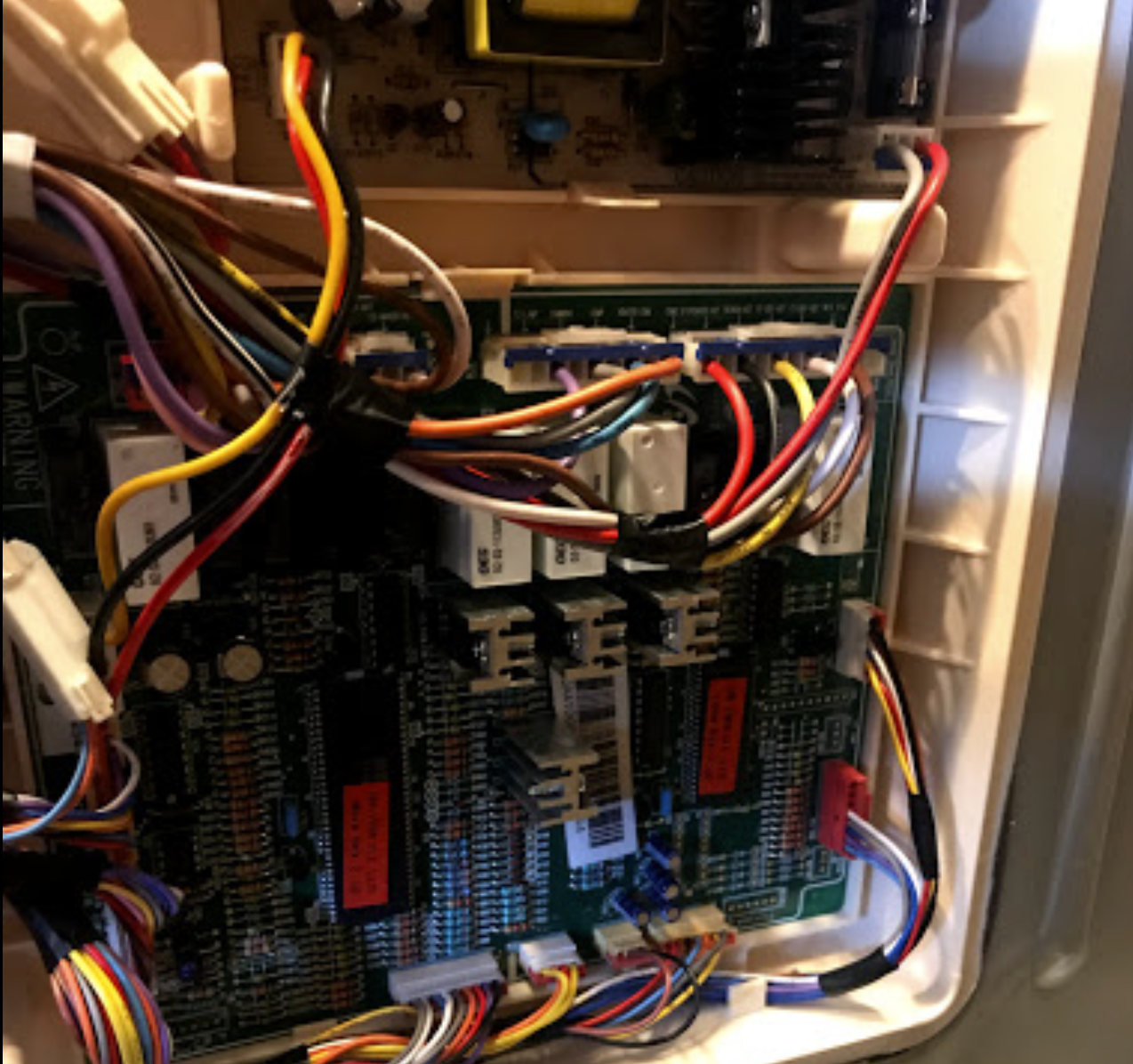 A bunch of wires are connected to a motherboard