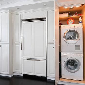 A kitchen with a washer and dryer stacked on top of each other.