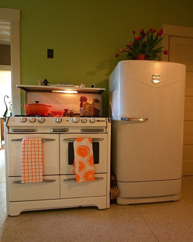 A white stove and a white refrigerator in a kitchen