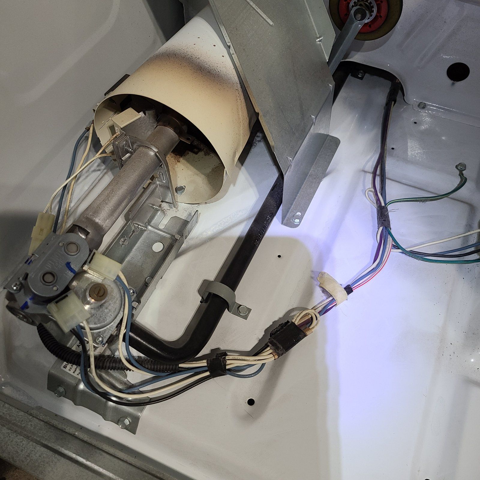 A close up of a machine with a lot of wires coming out of it
