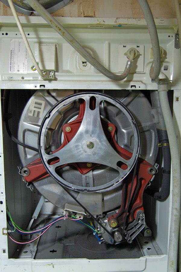 The inside of a washing machine with the door open.