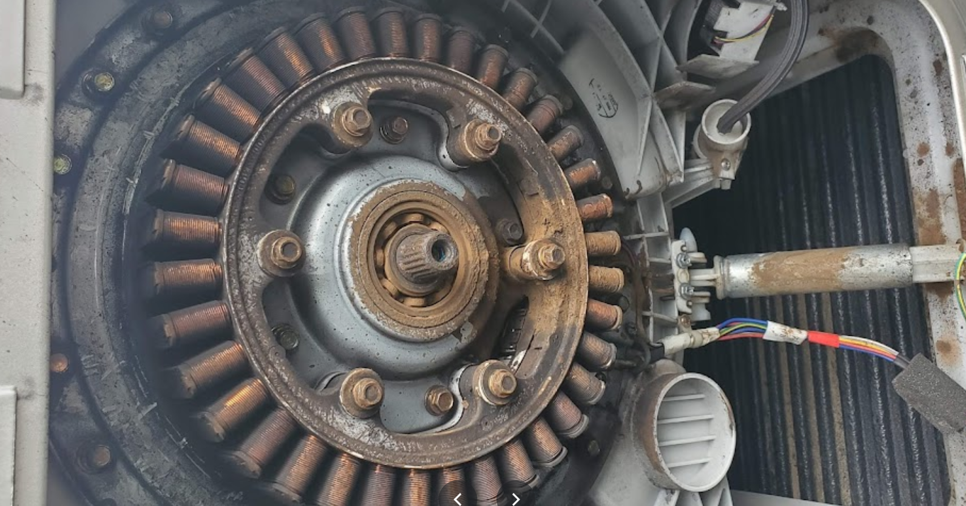 A close up of a wheel with a lot of wires coming out of it