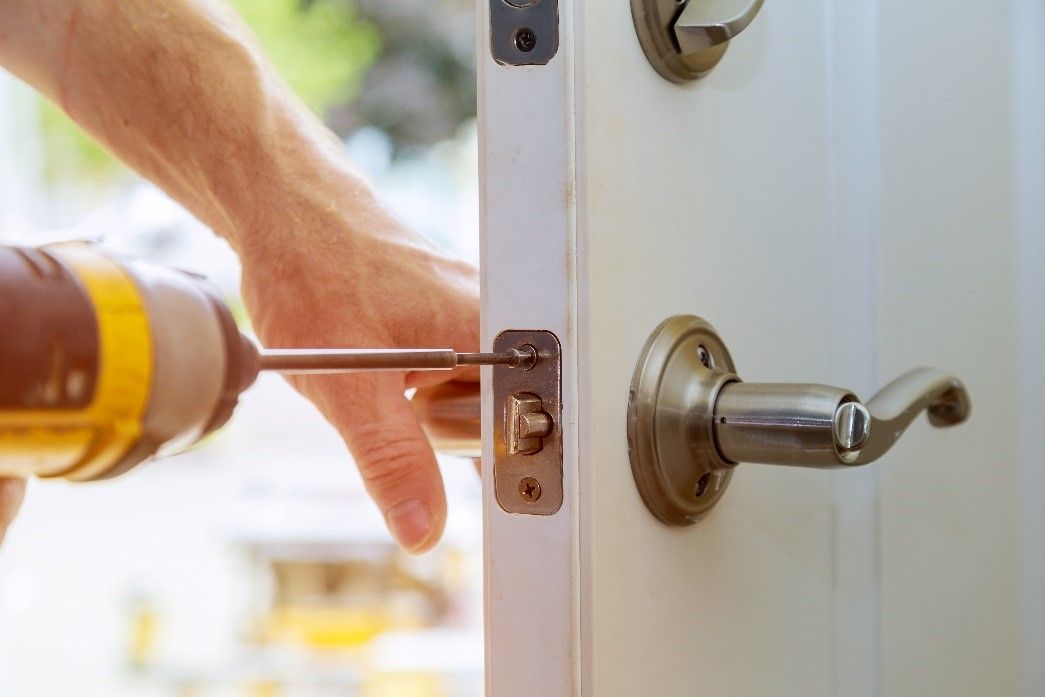 Locksmith fixing the Doorknob