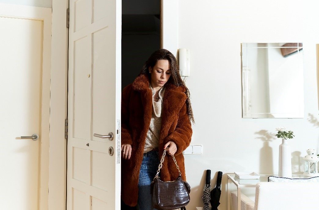 Woman entering to her apartment