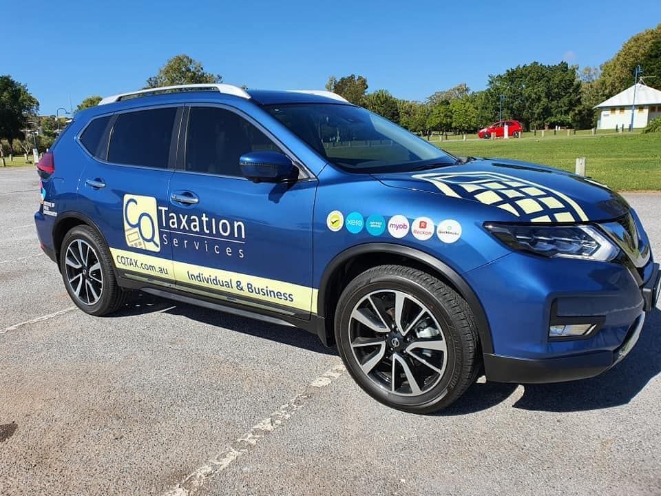 A Blue Car With the Word Taxation on the Side is Parked in a Parking Lot — Signtek Gladstone in Gladstone Central, QLD