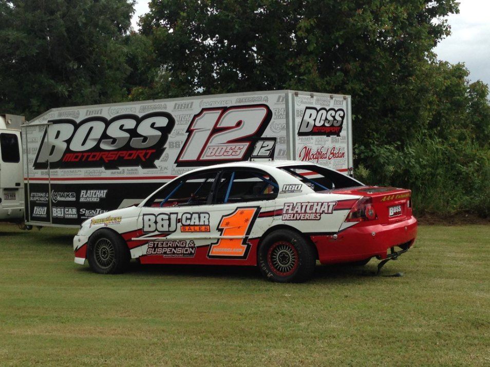 Stock Car With Number 1, Red and White Paint Scheme is Parked — Signtek Gladstone in Gladstone Central, QLD