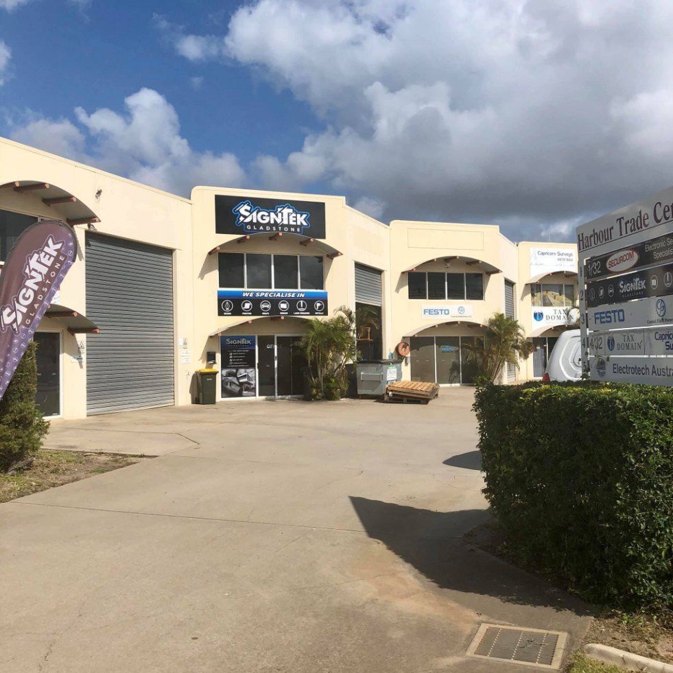 A Large Building With a Sign That Says Signfix on It — Signtek Gladstone in Gladstone Central, QLD