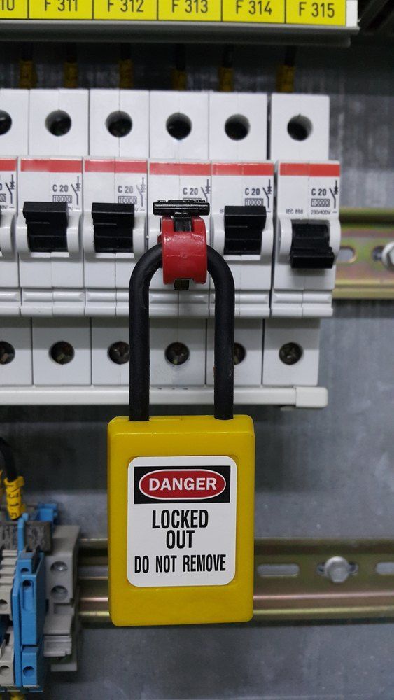 A Yellow Danger Lock is Attached to a Circuit Breaker — Signtek Gladstone in Gladstone Central, QLD