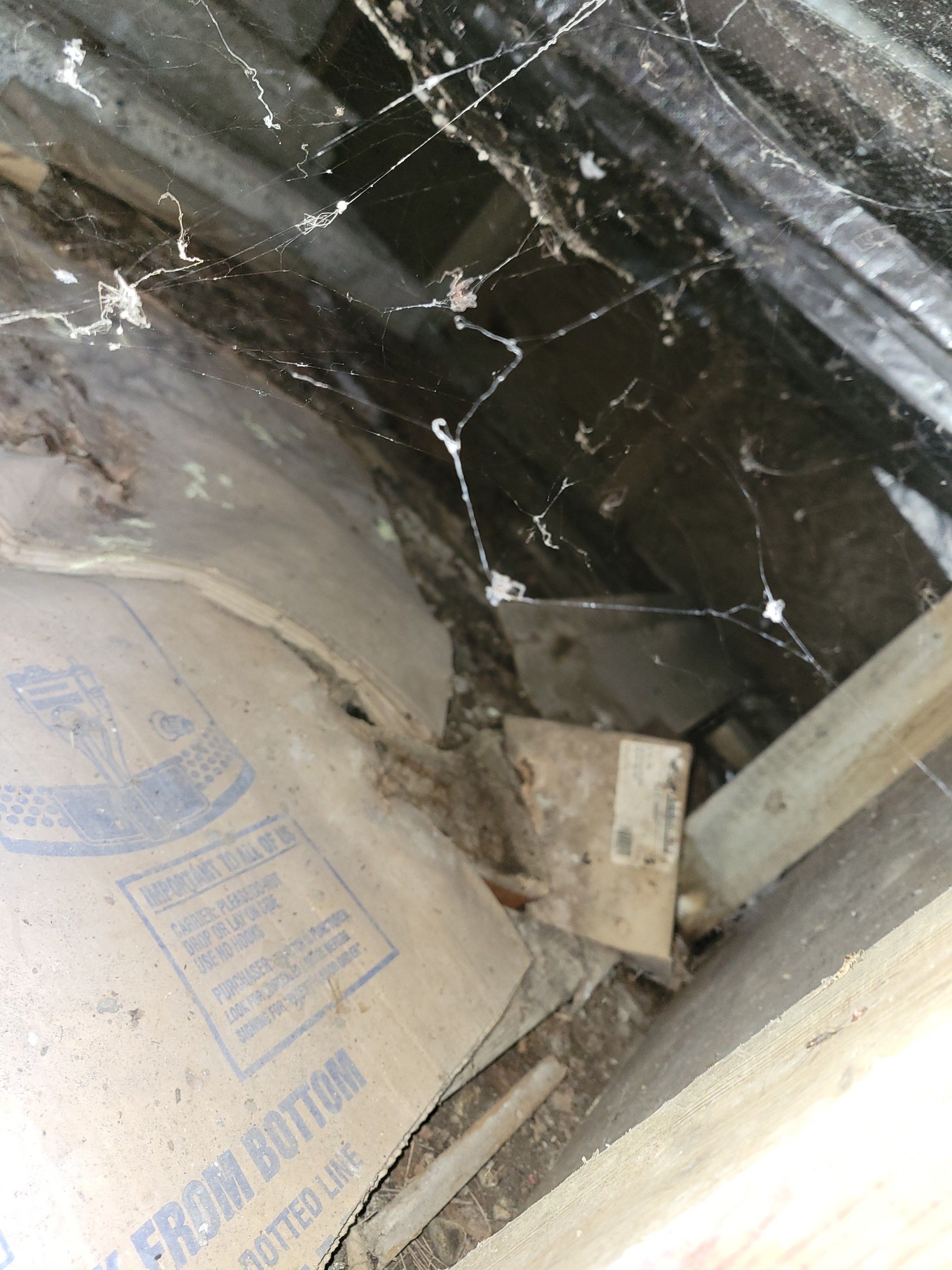 A piece of cardboard with the word bottom on it