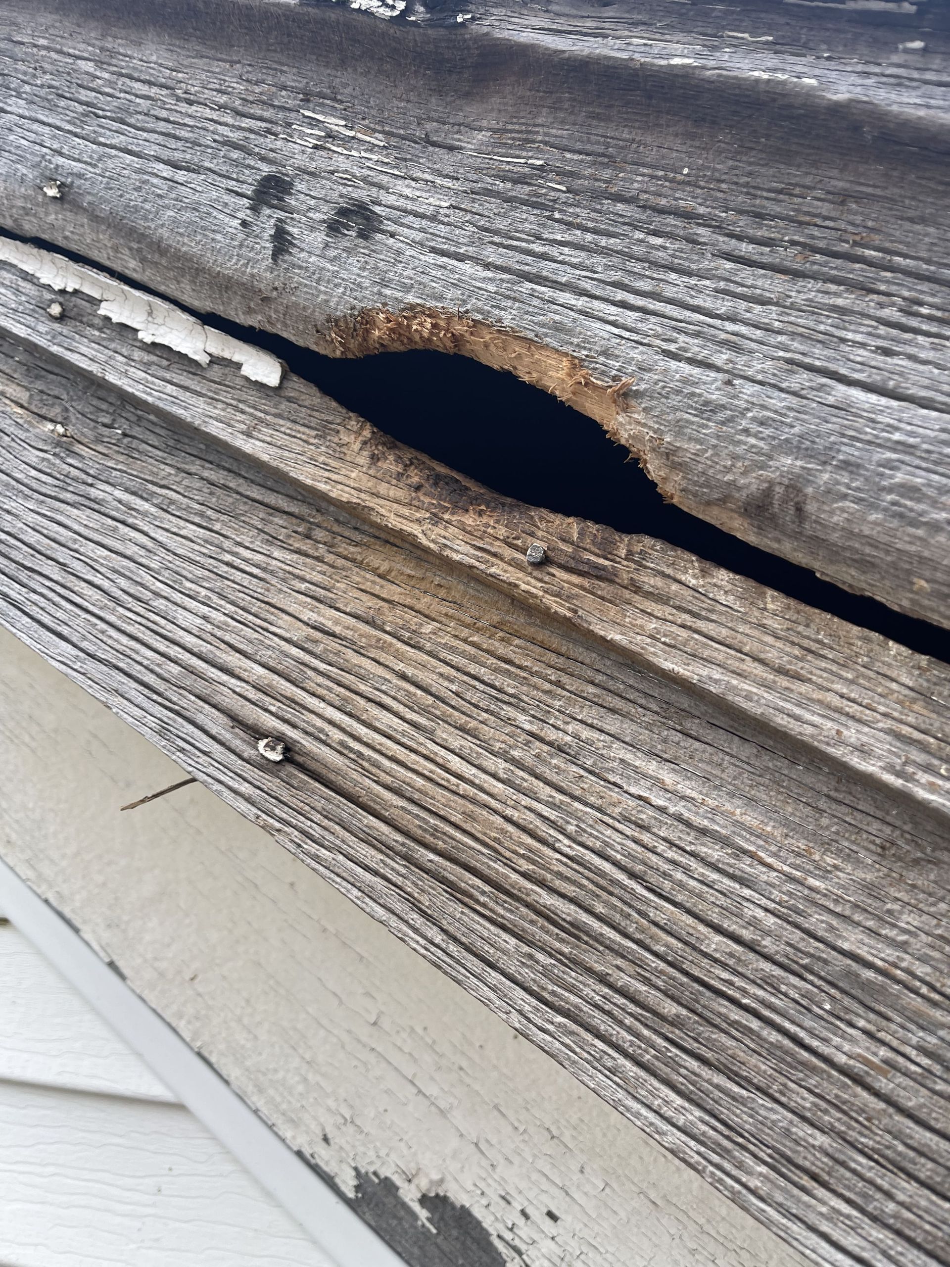 A close up of a piece of wood with a hole in it.