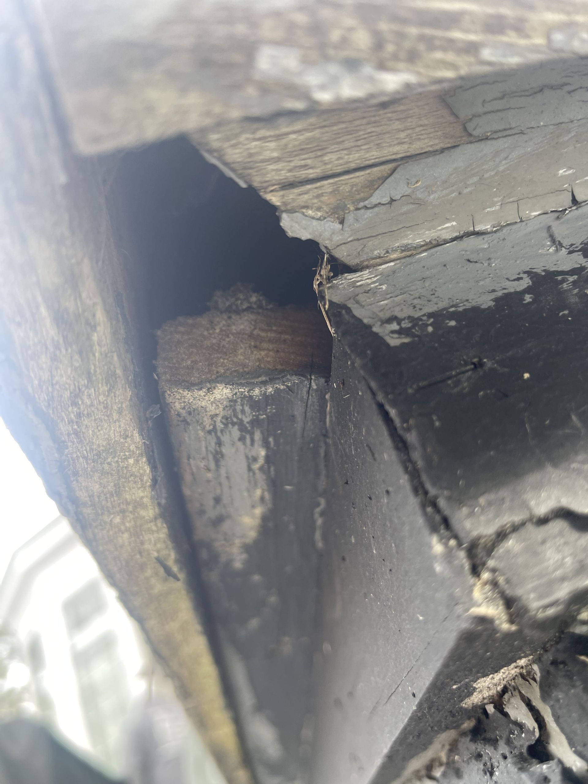 A close up of a piece of wood with a hole in it.