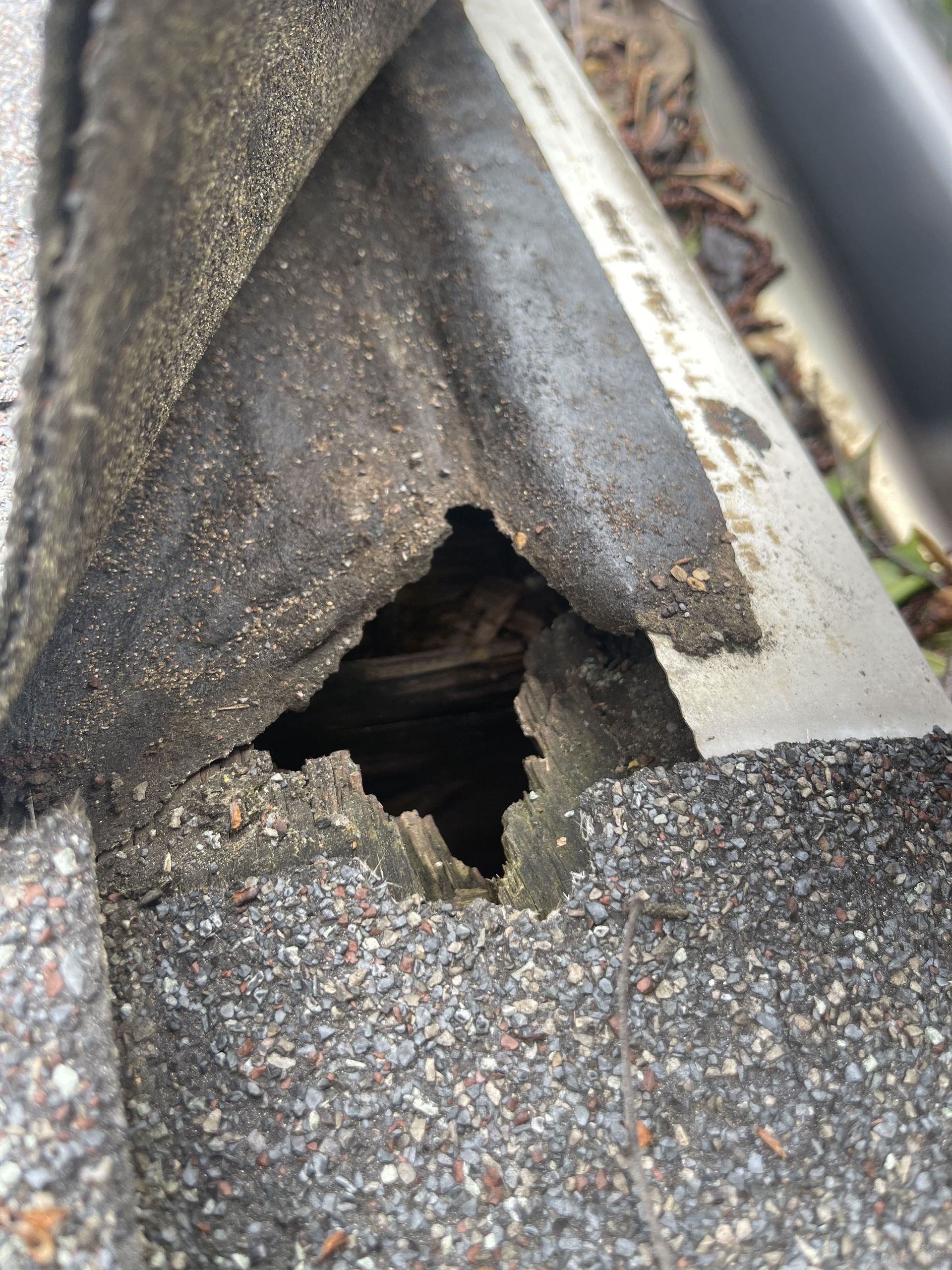 A close up of a roof with a hole in it