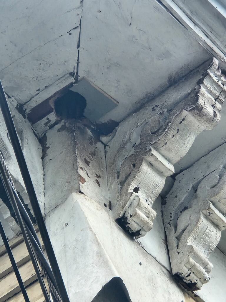 A staircase with a camera on the side of it