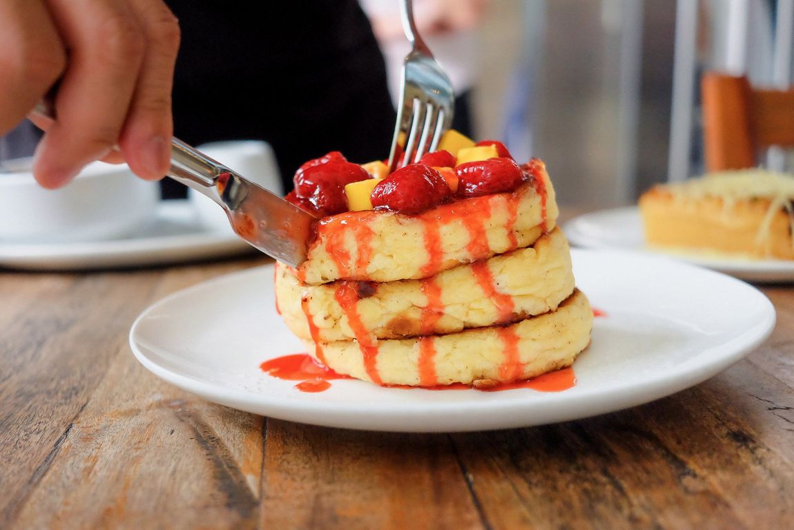 Enjoying delicious pancakes, a treat during a Makati staycation.