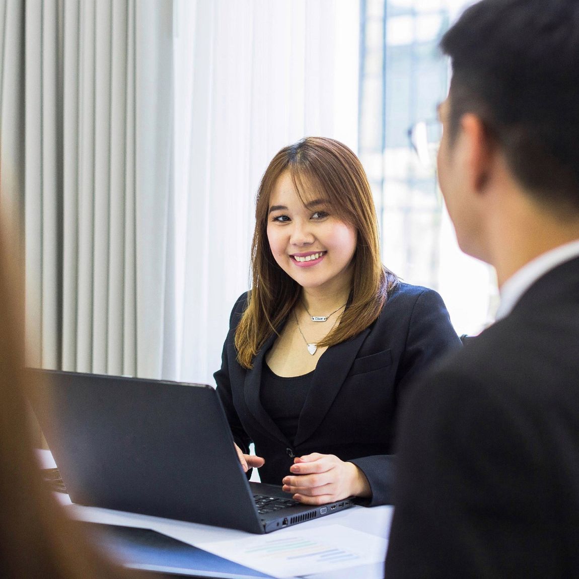 Staff assisting a guest at a Makati Hotel