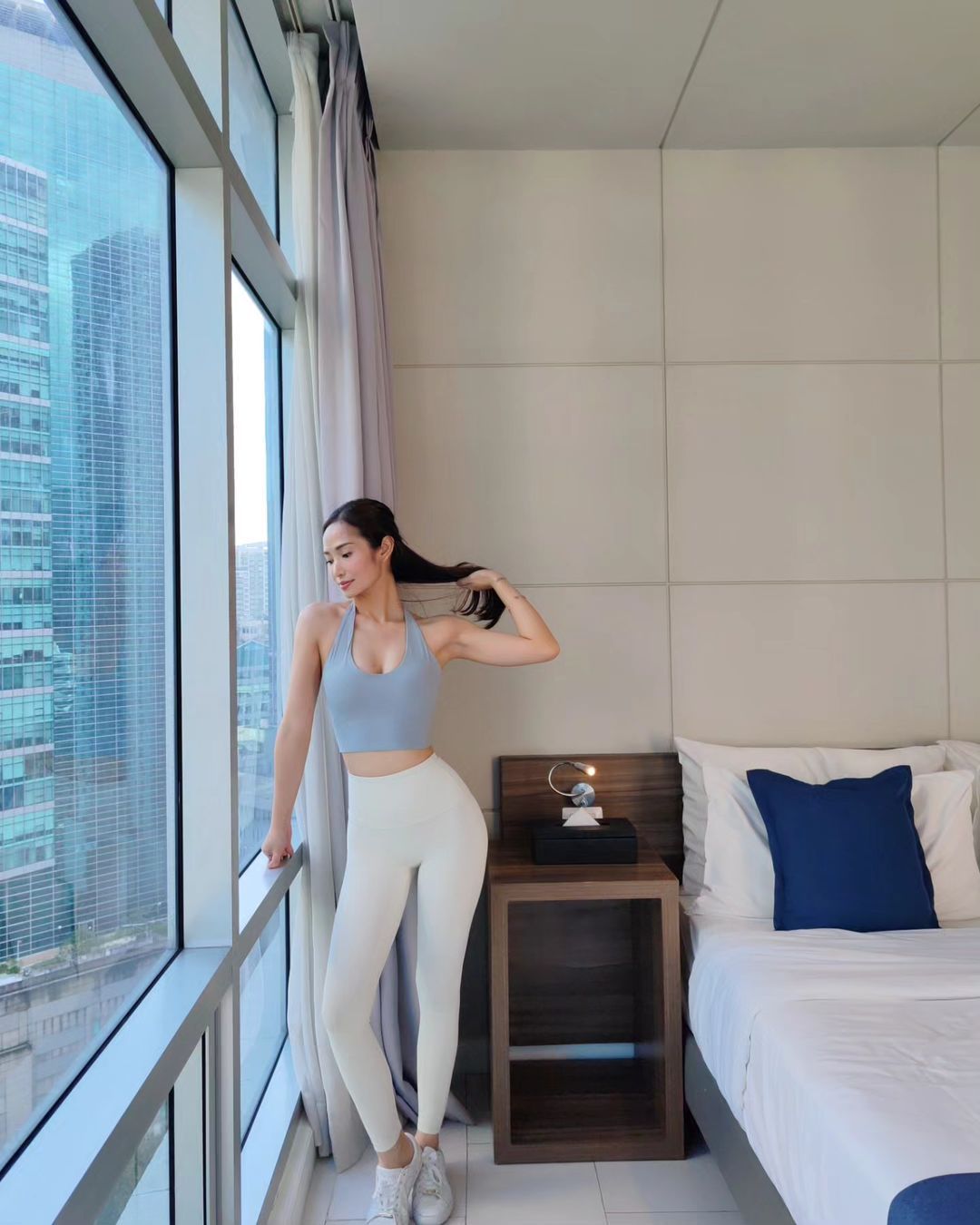 A woman enjoying the view during a Makati staycation