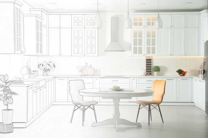 A drawing of a kitchen with white cabinets and a table and chairs.
