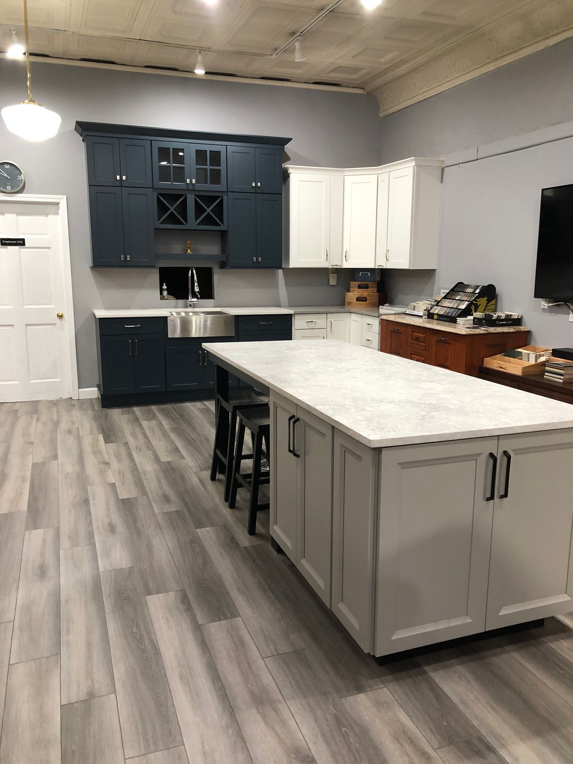 There is a large island in the middle of the kitchen.