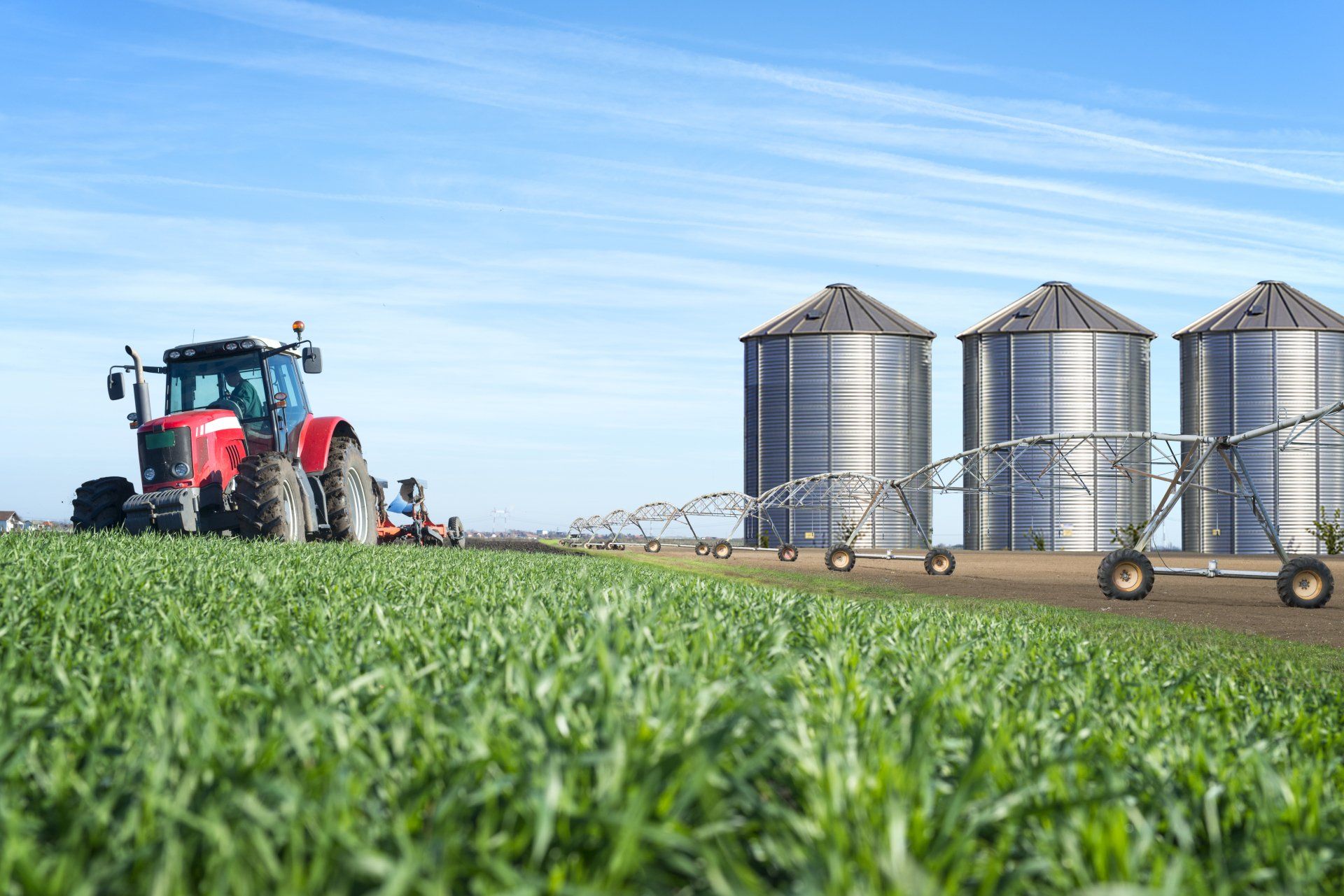 tractor plowing field or gathering crops