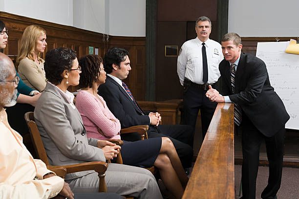 lawyer talking to jury with bailiff