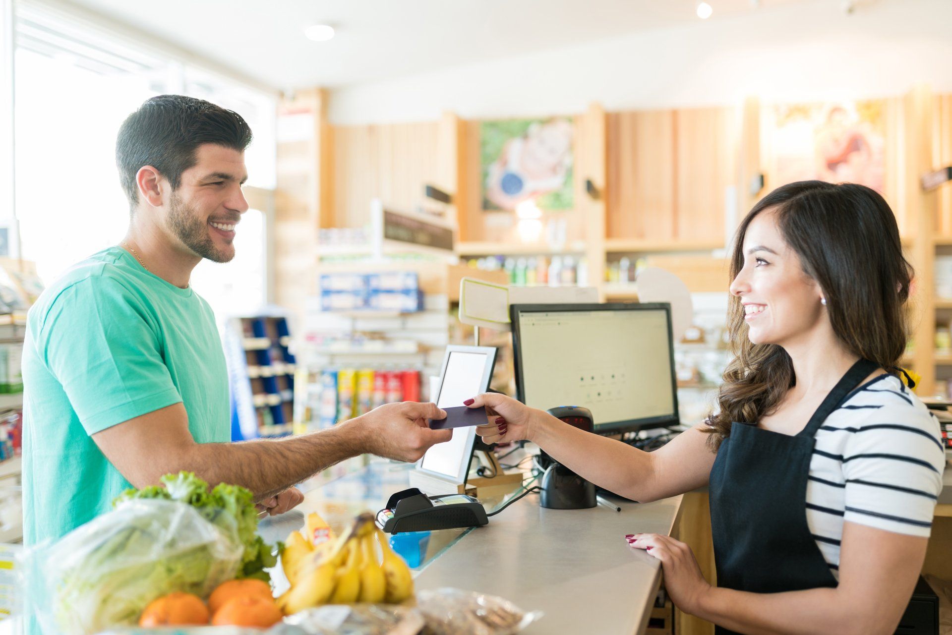 man checking out at cash register