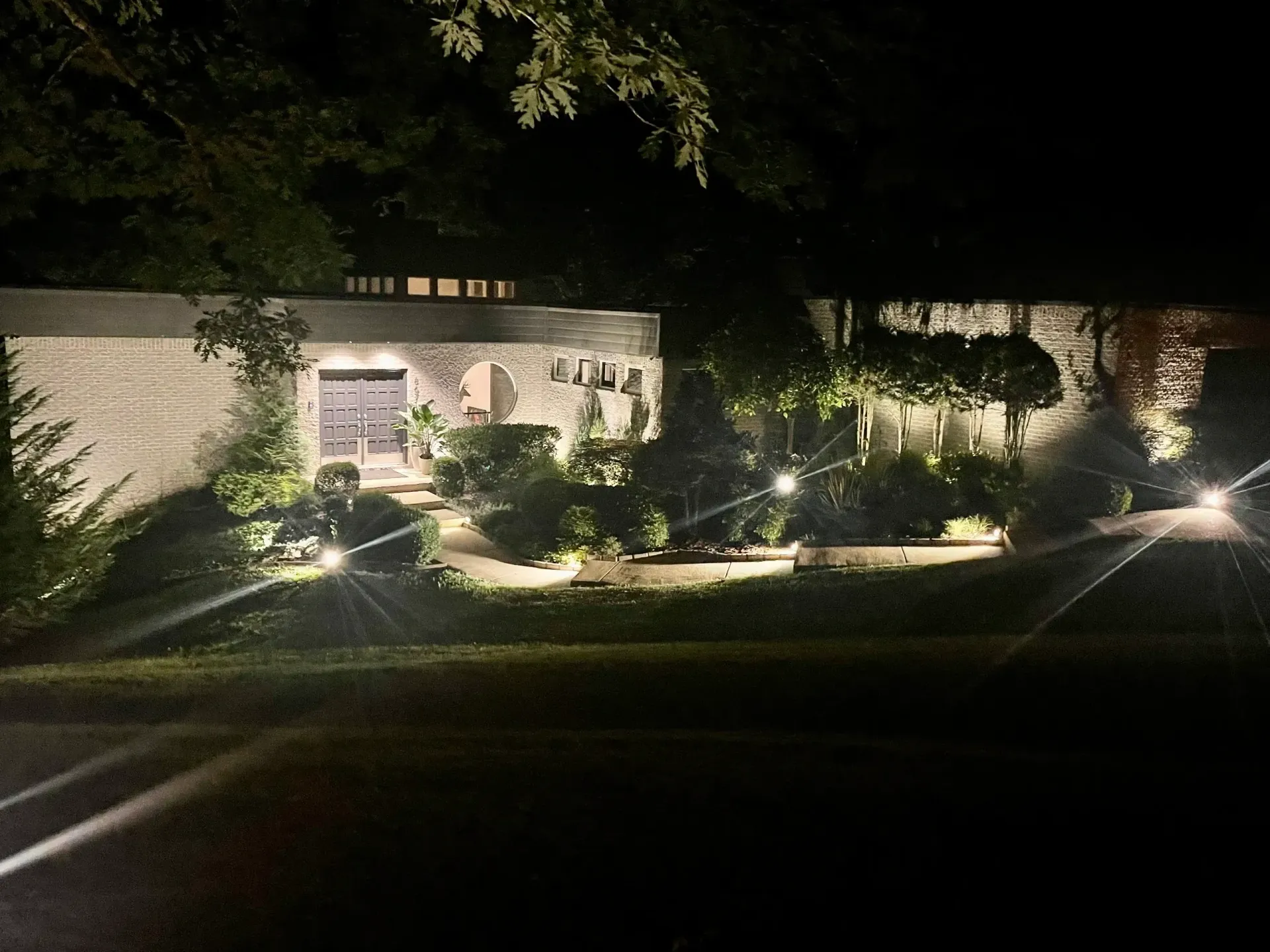 A house is lit up at night with lots of lights.