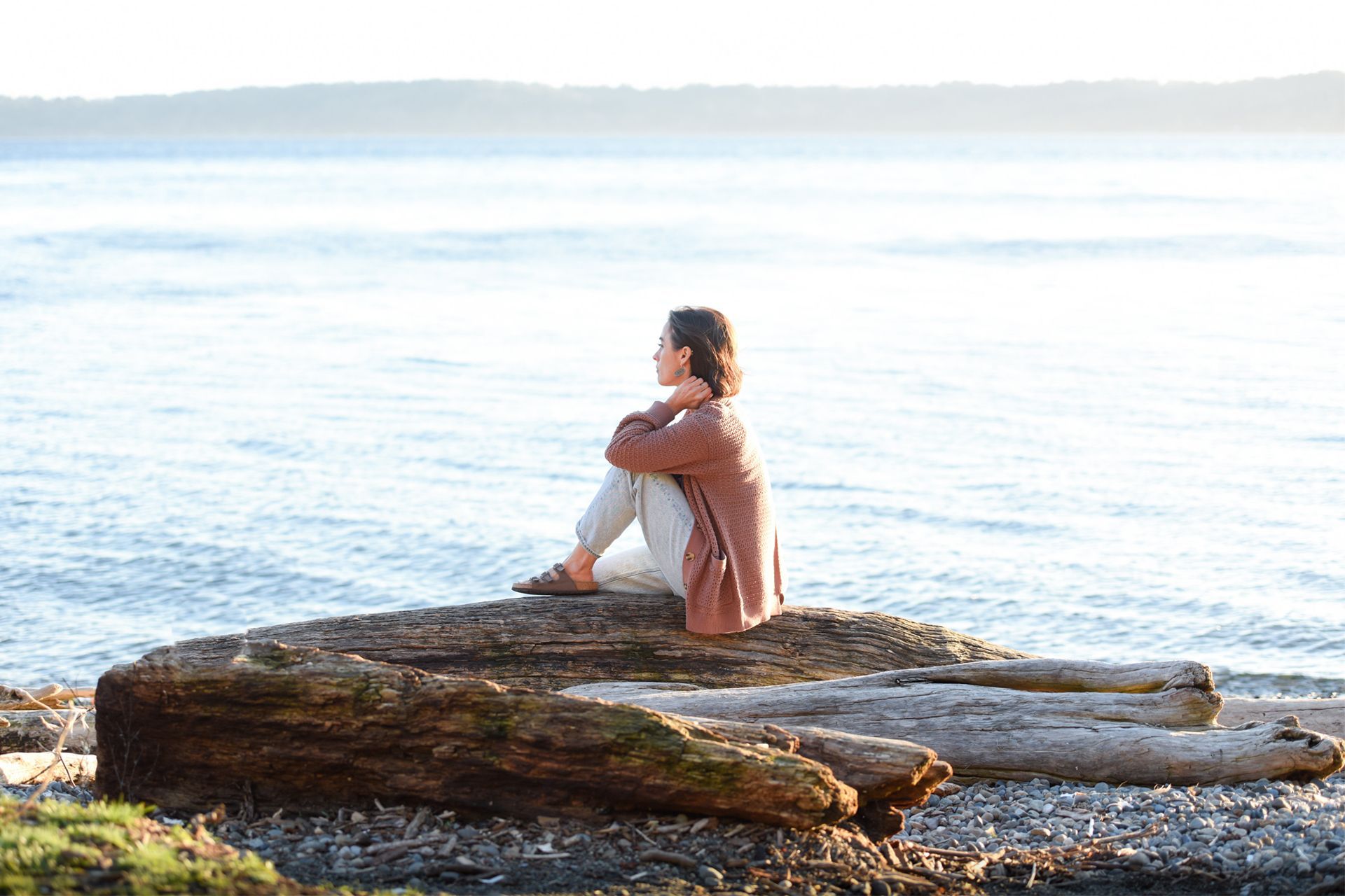 Danica Sitting on a Log at the Seashore