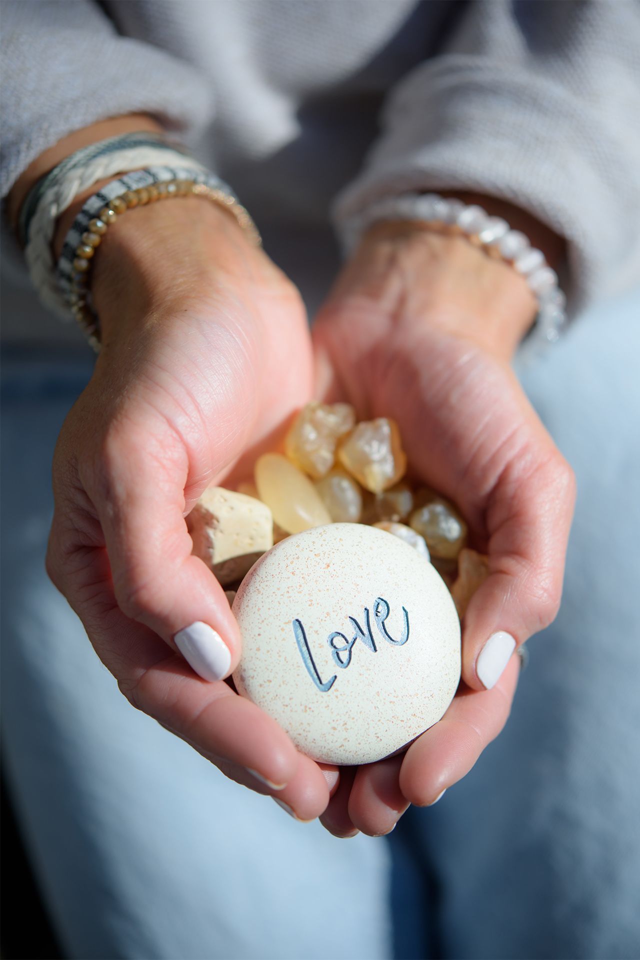 Danica Holding Love Stone