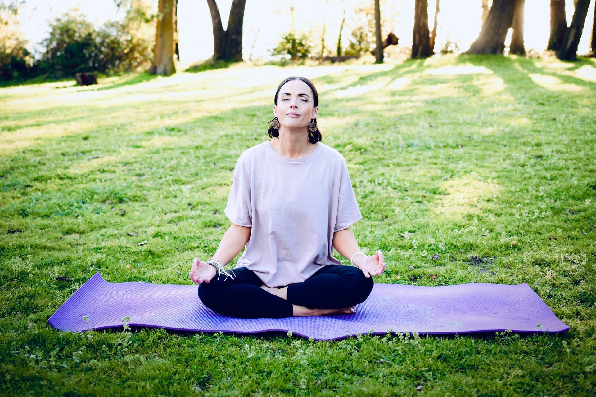 Danica Meditating in Park