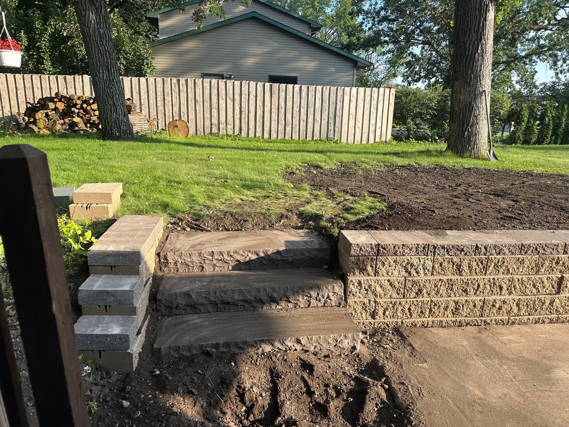 A staircase is being built in the backyard of a house. A staircase is being built in the backyard of a house.