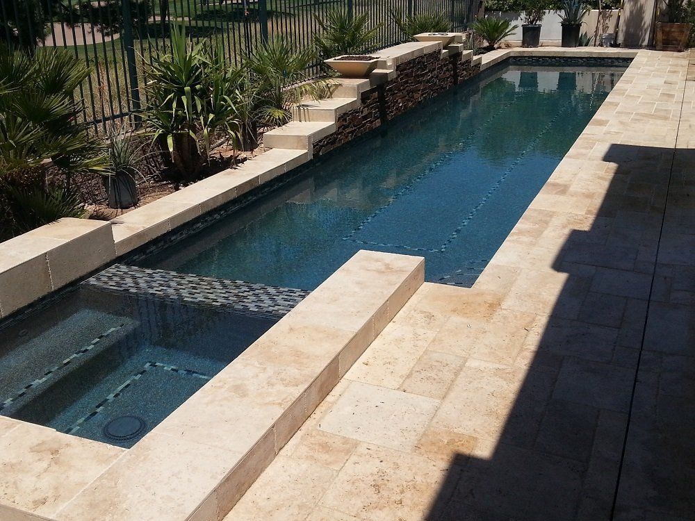 A large swimming pool with steps leading up to it