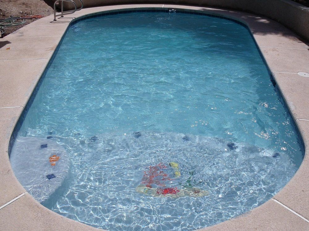 A large swimming pool filled with blue water