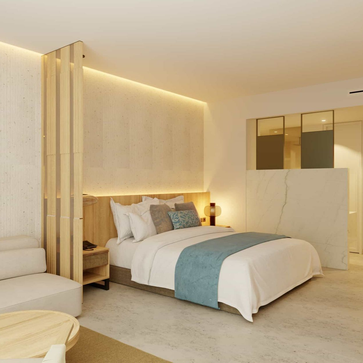 Cozy hotel bedroom with a bed, sofa, and wood accents. Neutral tones, including light wood and white bedding.