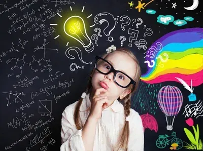 girl thinking with light buulb and chalkboard