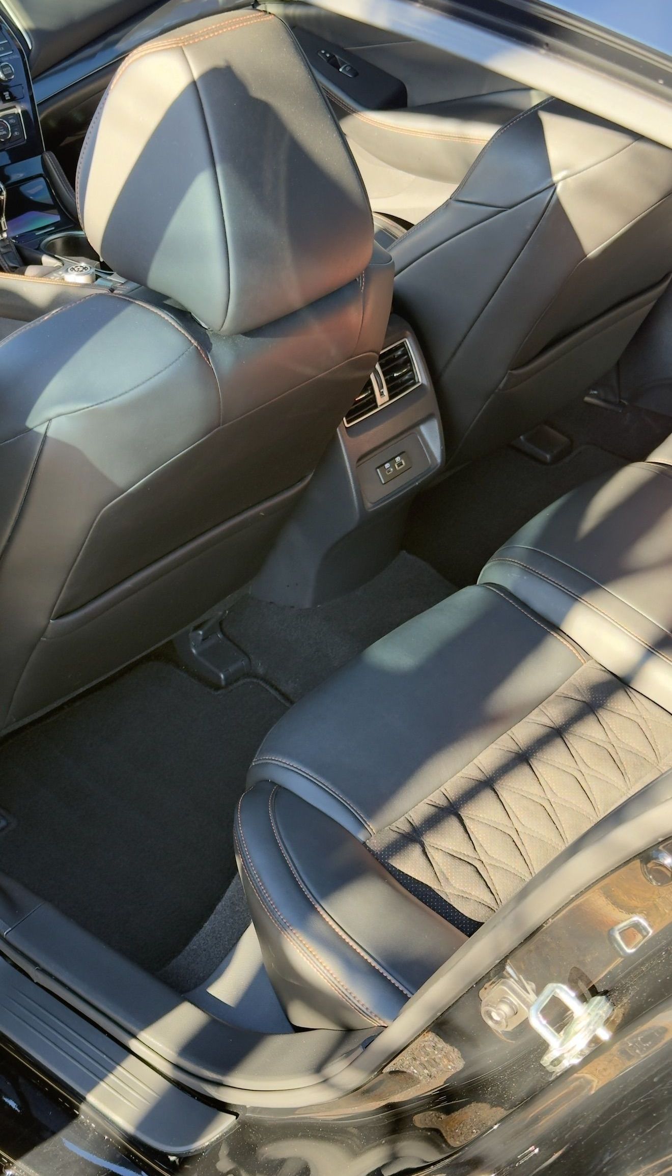 A close up of the back seat of a car.