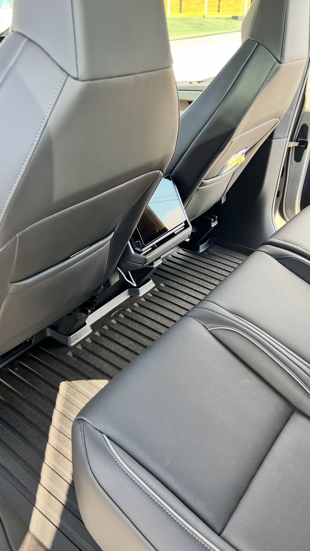A close up of the back seats of a car.